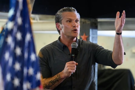 Pete Hegseth next to a US flag
