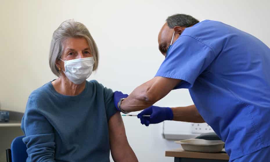 A patient receives a Covid-19 vaccine booster at a clinic in Birkenhead, Merseyside.