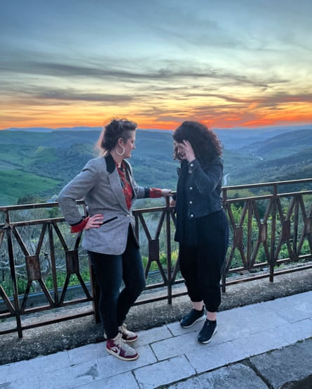 Kimberly Campanello, left, wearing Dunks, with her friend, the poet Dimitra Xidous, in Volturara Appula, Italy, 2024