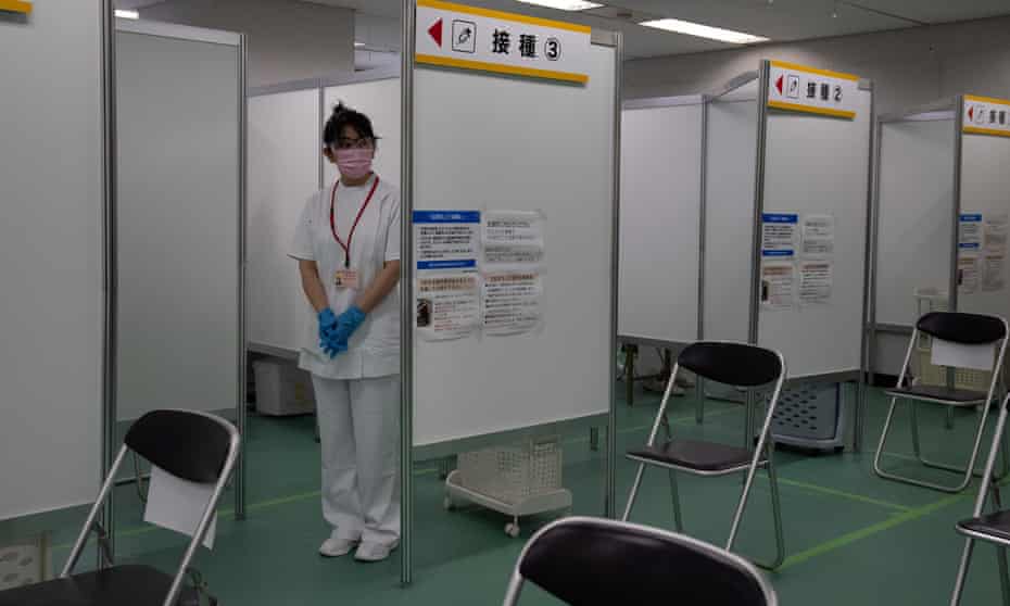 A nurse waits to inoculate people with the Moderna coronavirus vaccine at the newly-opened mass vaccination centre on May 24, 2021 in Tokyo, Japan.