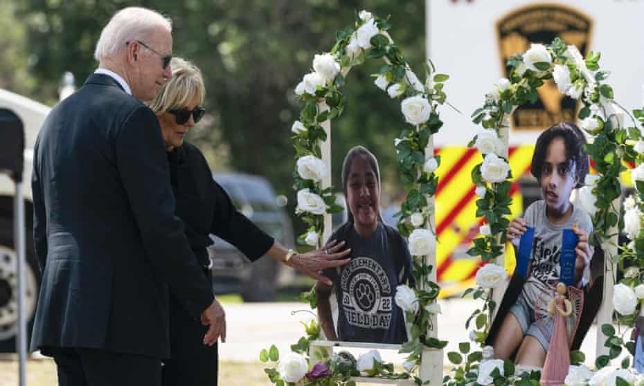 Joe and Jill Biden visit a memorial at Robb elementary school.