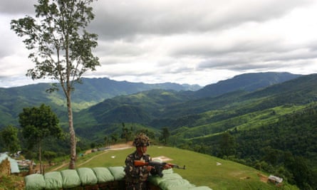 An Indian soldier stands guard at Henglep, about 60 miles south of Imphal, the capital of Manipur, a lush province in north-east India that borders Myanmar