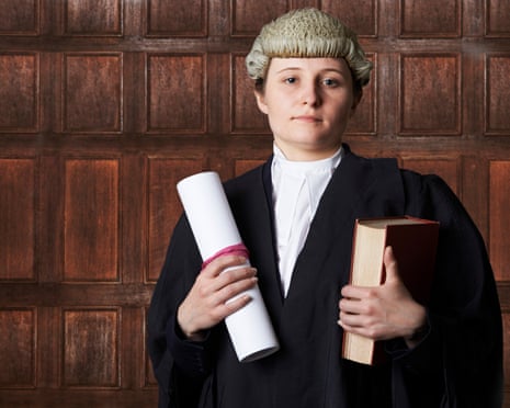 Portrait Of Female Lawyer In Court Holding Brief And Book