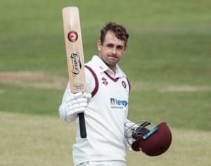 Charlie Thurston of Northamptonshire acknowledges the applause from his team mates on reaching his century.