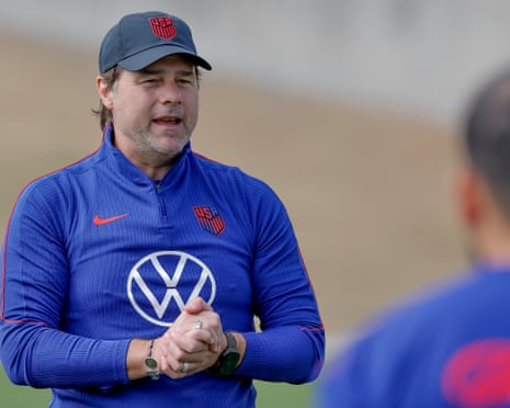 The USMNT spots every European club is watching — US coach Mauricio Pochettino in blue USA training jacket speaks with hands clasped during outdoor training.
