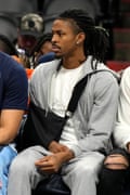 Memphis Grizzlies guard Ja Morant sits on the bench during the first half of a game against the Suns on Sunday in Phoenix.