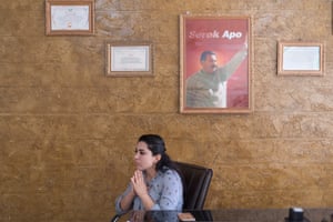 Ronaz Younes, co-chair of Tal Tamr municipality, in her office, under the picture of Abdullah Ocalan