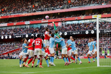Gianluigi Donnarumma punches clear under pressure during the Premier League match between Arsenal and Manchester City.