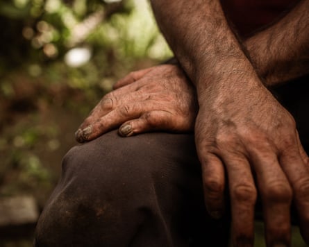 Closeup of a man’s muddy hands