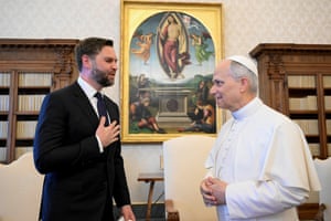 Pope Leo smiles at JD Vance, who has his hand on his heart