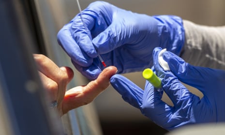 A health worker takes a blood sample for a Covid-19 antibody test in Los Angeles. 