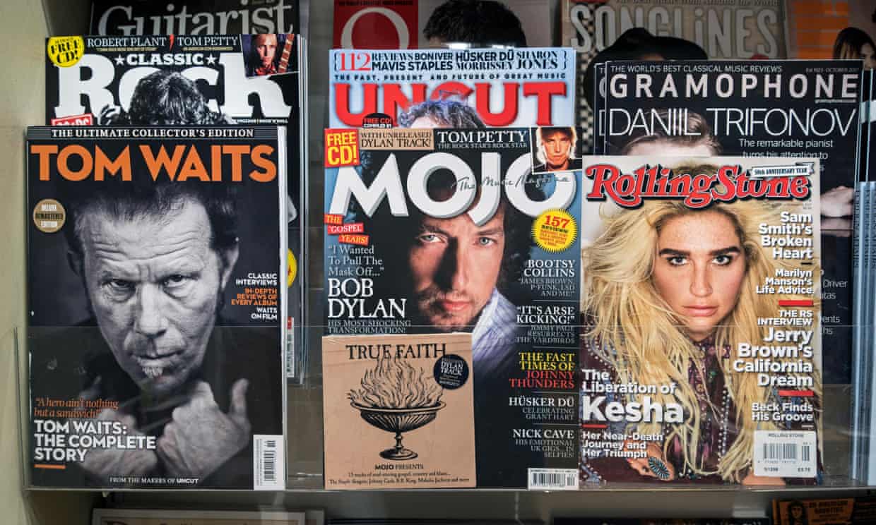 Rolling Stone magazine is seen on display with other music publications.