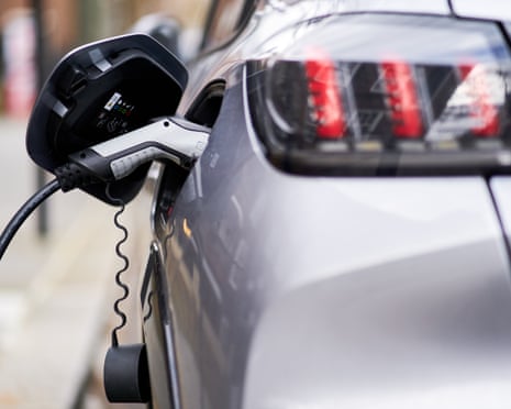 Charger plugged in to an EV