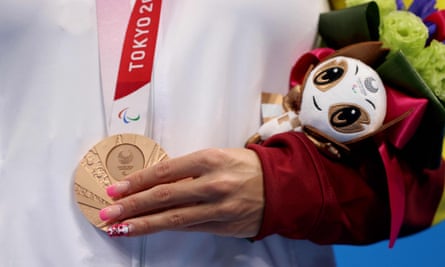 Spain’s bronze medallist Nuria Marques Soto on the podium carrying the mascot she was given at the Tokyo Summer Olympics.
