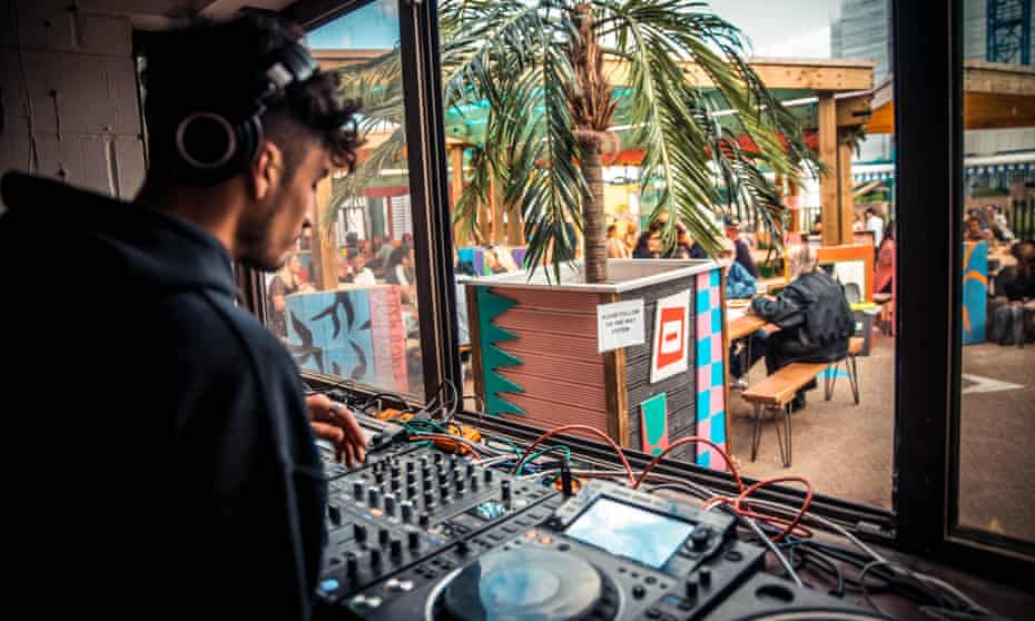 A DJ at the summer opening of Costa Del Tottenham in north London.