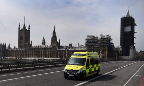 An ambulance drives over Westminster Bridge in London, 16 April 2020.
