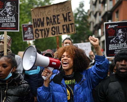 Activists march at Black Lives Matter protest in June 2020.