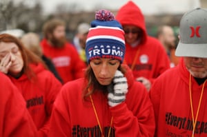 Donald Trump supporters pray on the National Mall during the ceremony
