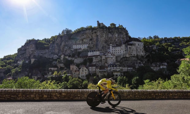 Jonas Vingegaard, wearing the overall leader’s yellow jersey, cycles past Rocamadour during the 20th stage of the Tour de France.