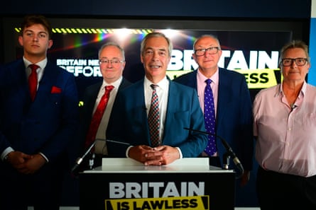 Finch looks on as Nigel Farage speaks at a Reform UK press conference