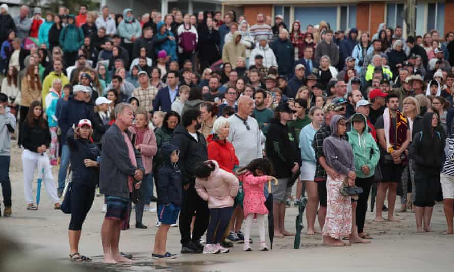 People attend the dawn service at Currumbin, during Anzac Day in Gold Coast, Monday, April 25, 2022.