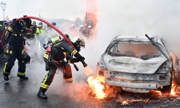 A torched car on Rue de Rivoli.