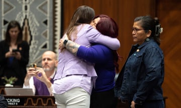 Women hug on floor of legislature
