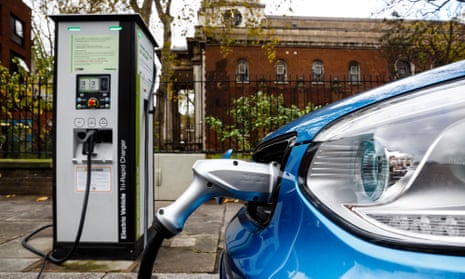 An electric car is charged on a London street.