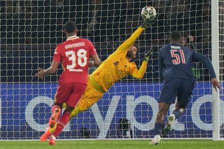 Alisson stretches to make a save against PSG