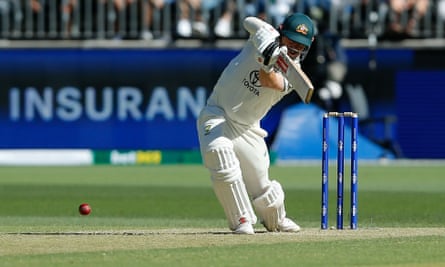 Travis Head of Australia plays a cover drive during the first Test against Pakistan at the Optus Stadium in Perth on 14 December 2023.