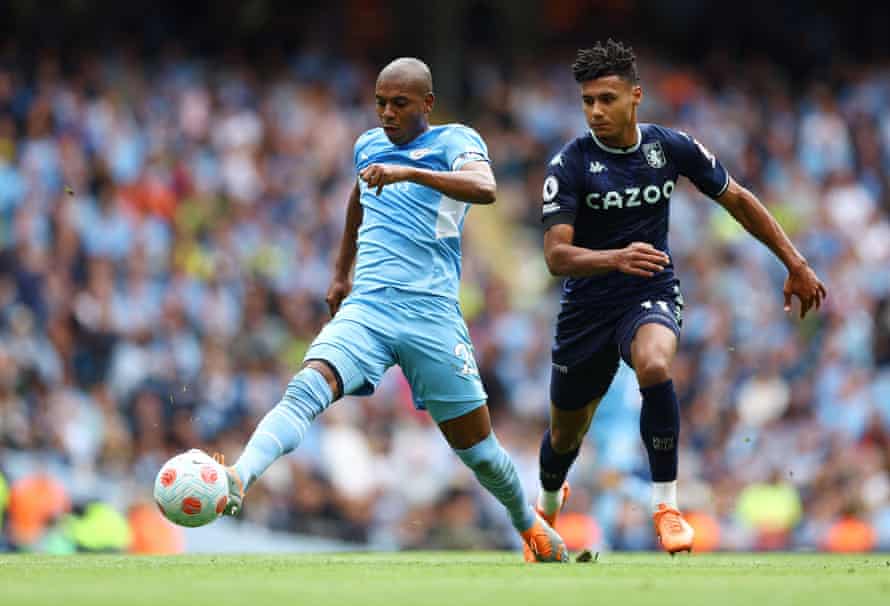 Fernandinho in action with Ollie Watkins.