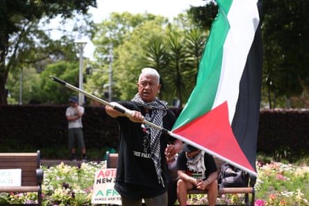 A man waves a Palestinian flag at the rally in Hyde Park