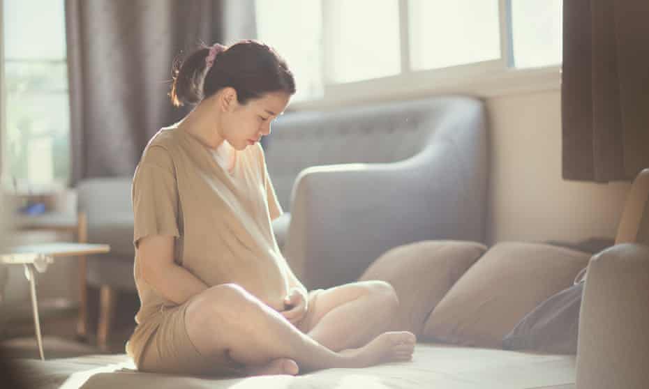 Pregnant woman at home (posed by a model)