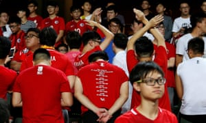 Hong Kong football fans turn their backs during the Chinese national anthem.
