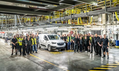 Ellesmere Port workers gather around a newly built Vauxhall Combo Electric.