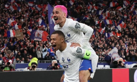 Antoine Griezmann, sporting a new hairstyle, celebrates his goal with Kylian Mbappé