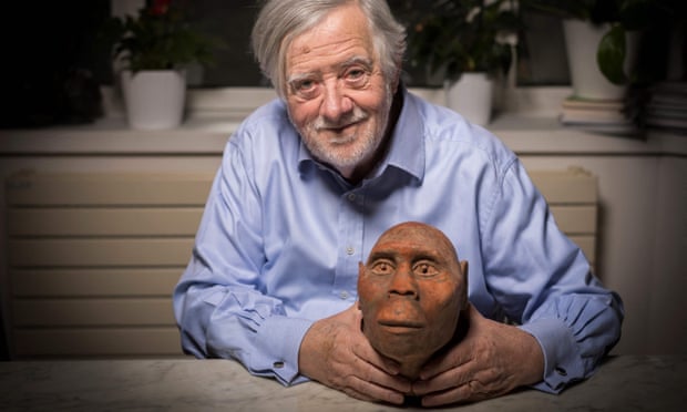 Yves Coppens at his home in Paris, holding a head model of Lucy. The French palaeontologist was feted for his role in the discovery of the early human fossil in Ethiopia.