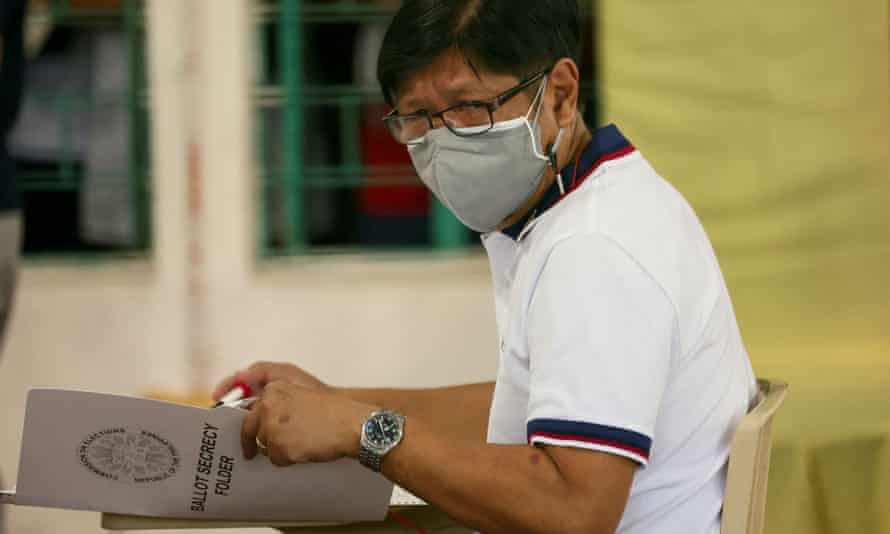 Ferdinand “Bongbong” Marcos, the son and namesake of the late dictator, casts his vote in the 2022 national elections in Ilocos Norte, the Philippines, on 9 May.