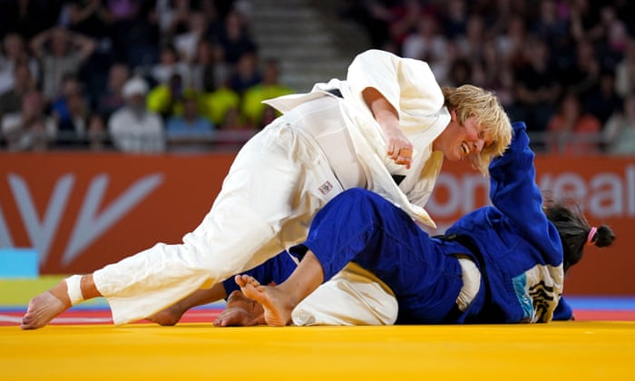 Scotland’s Sarah Adlington (white) on her way to winnng gold in the women’s +78kg final.