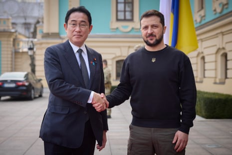 Fumio Kishida and Volodymyr Zelenskiy greet each other during their meeting in Kyiv.