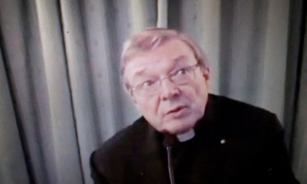 Pell is seen on a screen giving evidence to Australia’s royal commission into institutional responses to child sexual abuse via videolink from Rome