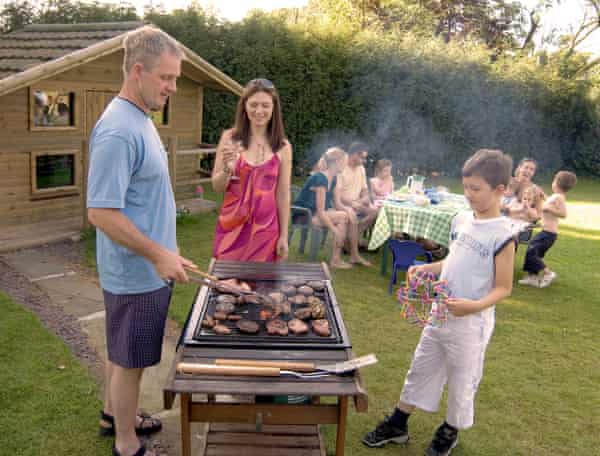 Families in outdoor setting having BBQs