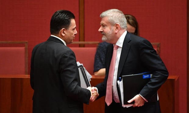 Nick Xenophon congratulates minister for communications Mitch Fifield after passing the media ownership bill in the Senate.