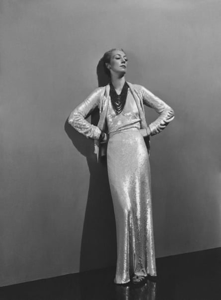 Jose-Maria Sert wears a long white sequin dress by Chanel in 1936.