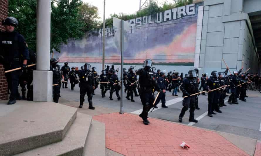 A police line approaches demonstrators protesting the lack of charges in the killing of Breonna Taylor in Louisville on 25 September 2020.