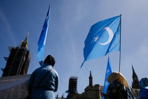 Members of the Uighur community demonstrate outside the Houses of Parliament in London. MPs voted to declare that China was committing genocide against Uighurs in Xinjiang.