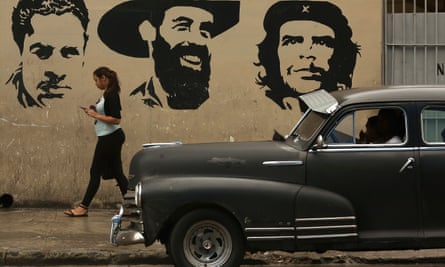 A mural in Havana depicting (L-R) Cuban Comunist party founder Julio Antonio Mella and revolutionary leaders Camilo Cienfuegos and Che Guevara.