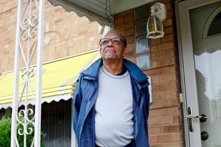 Tim Pegues on the front porch of his home in Chicago.