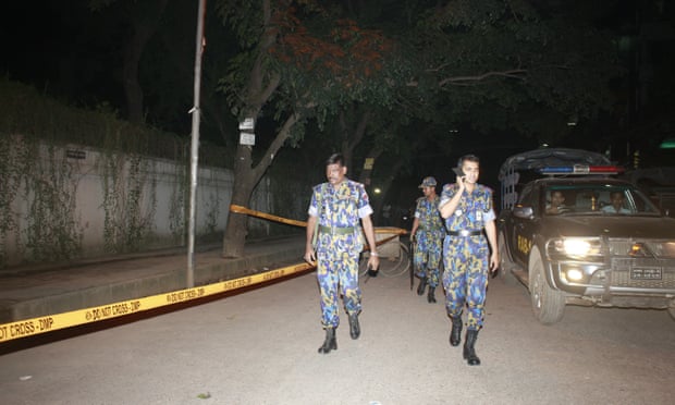 Bangladeshi police at = site where Cesare Tavella was shot dead in Dhaka