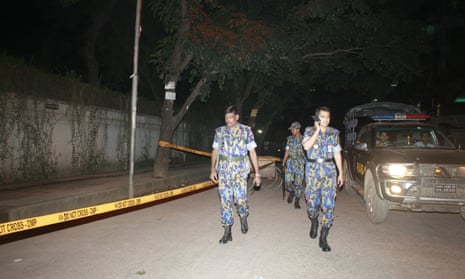 Bangladeshi police at = site where Cesare Tavella was shot dead   in Dhaka